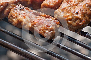 Minced meat rolls on grill (traditional Romanian food) Ã¢â¬â mititei, mici